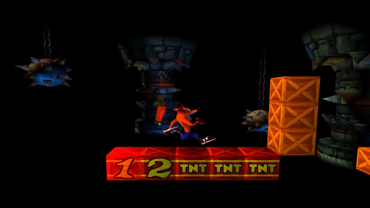 Crash Bandicoot standing beside TNT crates inside an original bonus round