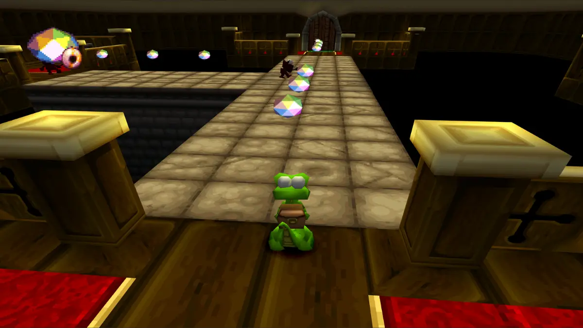 Croc collecting colored crystals in Croc Legend of the Gobbos